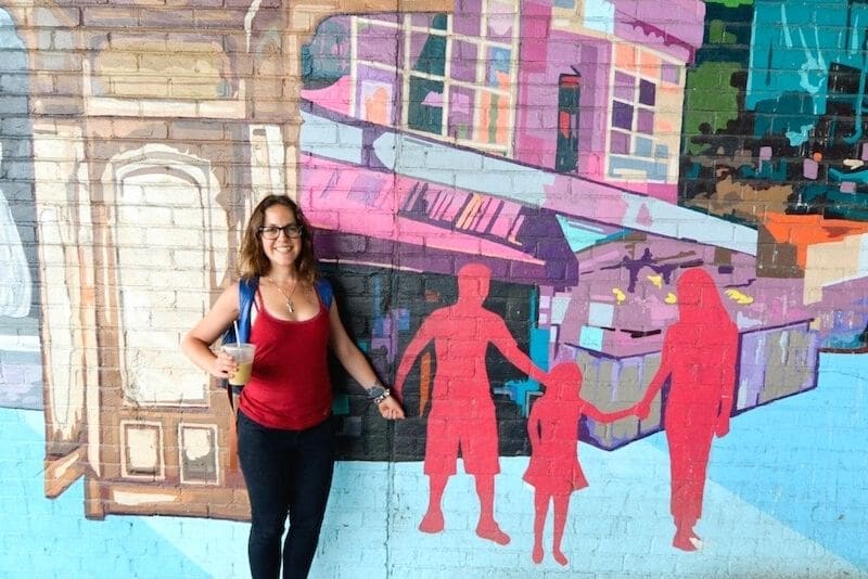 Exploring murals recommended in an I Love NY travel guide